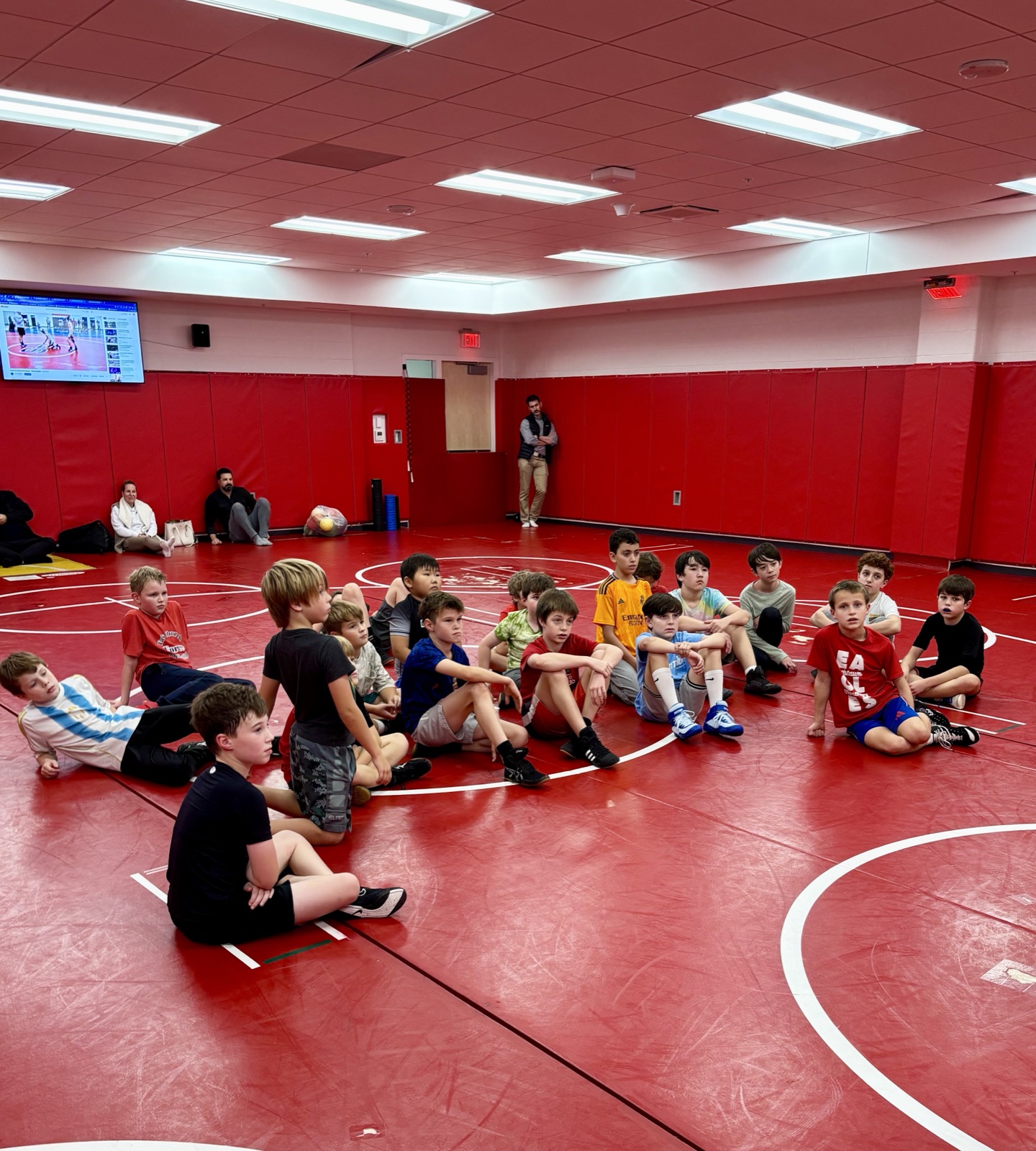 Team listening to coach at practice