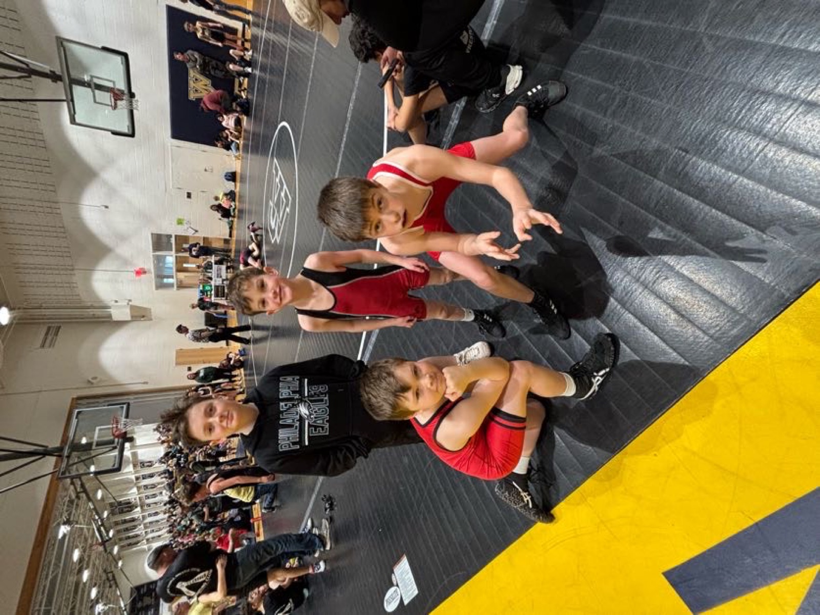 Wrestlers posing at a tournament
