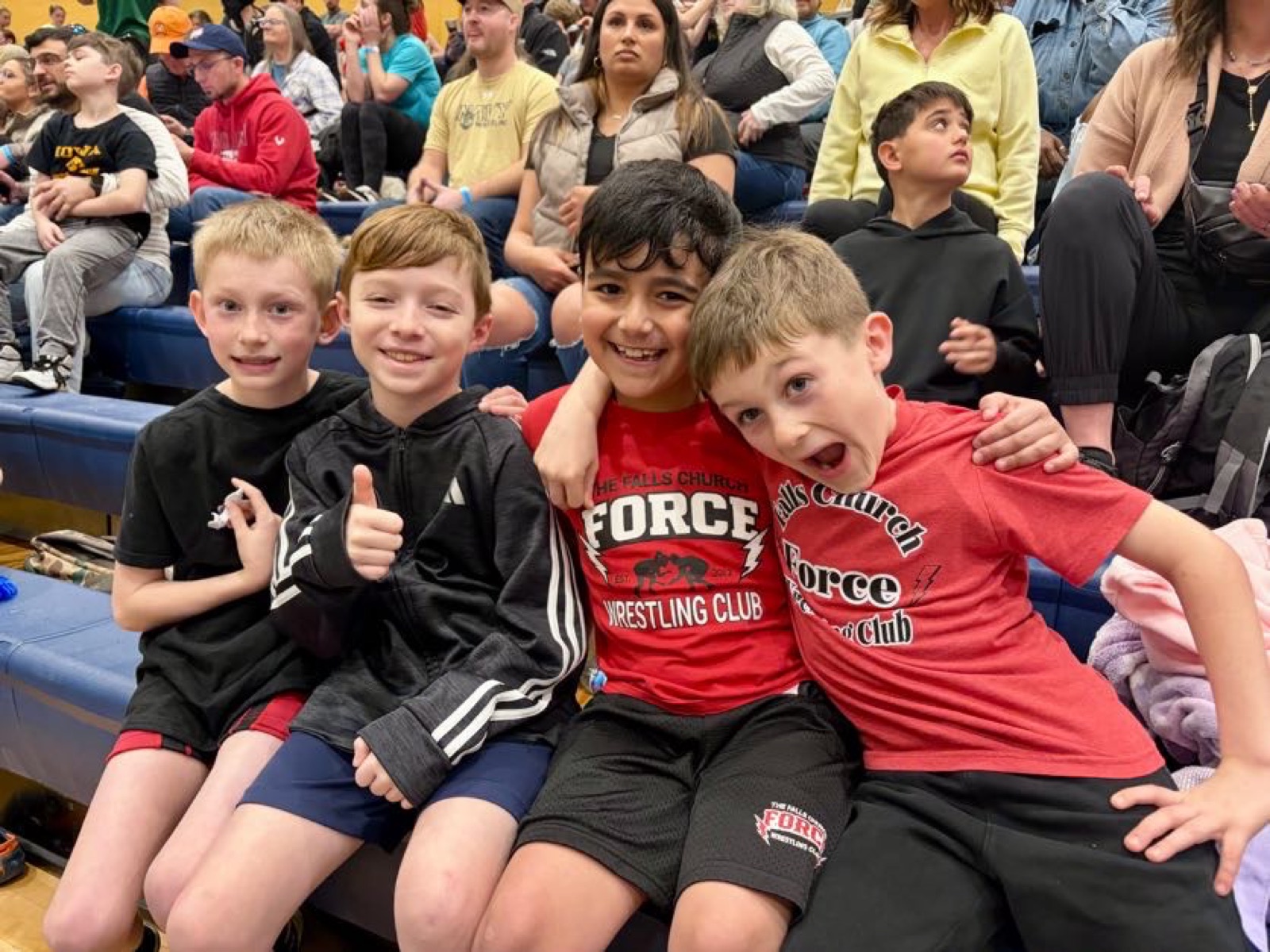 Wrestlers posing at a tournament